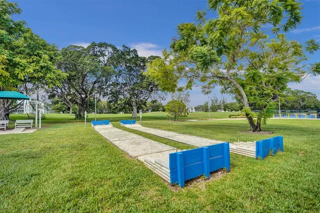 a view of a park with large trees