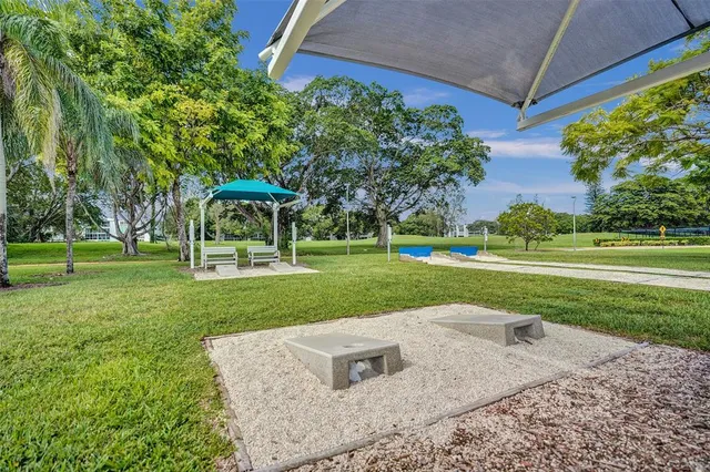 a view of a patio with a yard