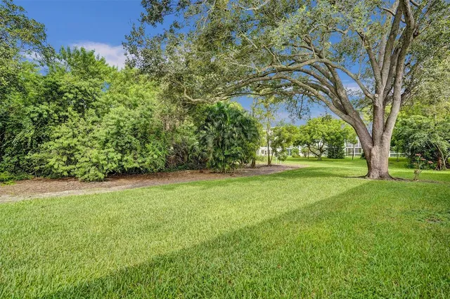 a view of a yard with an outdoor space and seating area