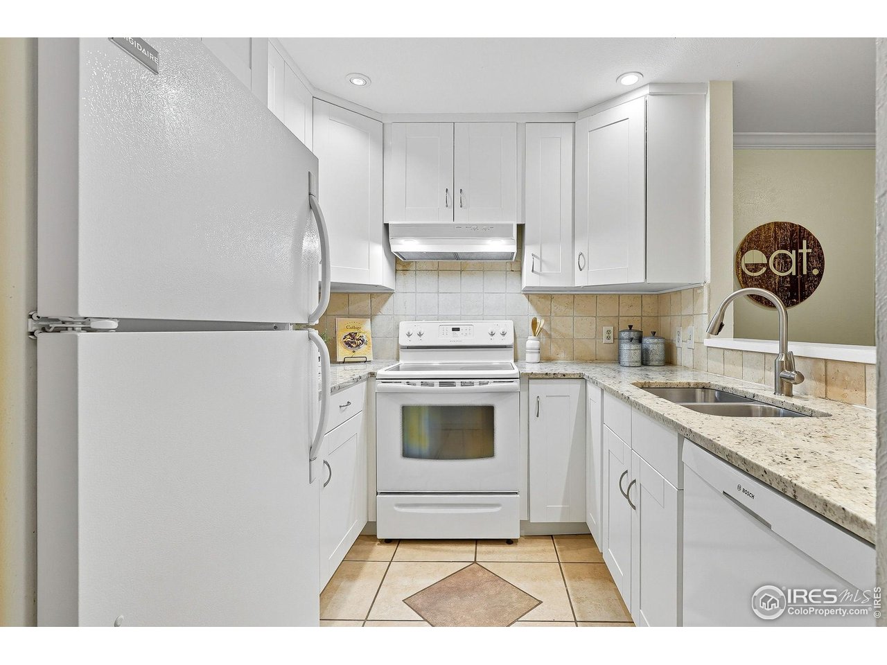 1303 Alpine Avenue, Unit 24 Boulder, CO 80304 - Photo 11 of 46 a kitchen with a refrigerator sink and cabinets