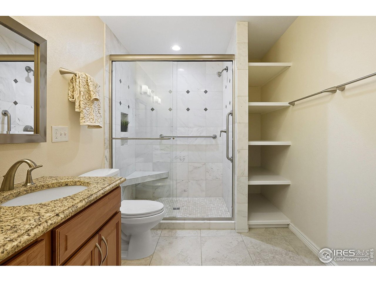 1303 Alpine Avenue, Unit 24 Boulder, CO 80304 - Photo 22 of 46 a bathroom with a granite countertop sink toilet and shower
