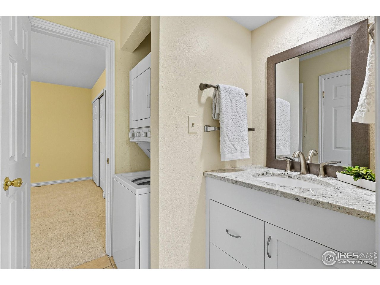 1303 Alpine Avenue, Unit 24 Boulder, CO 80304 - Photo 27 of 46 a bathroom with a granite countertop sink mirror and a shower