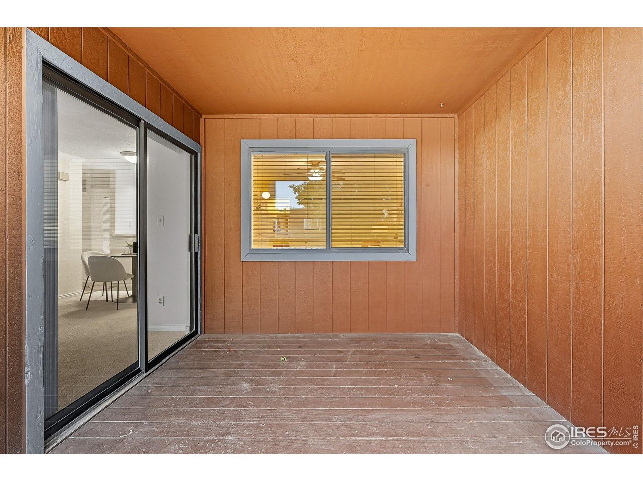 1303 Alpine Avenue, Unit 24 Boulder, CO 80304 - Photo 7 of 46 a view of an empty room with wooden floor and a window