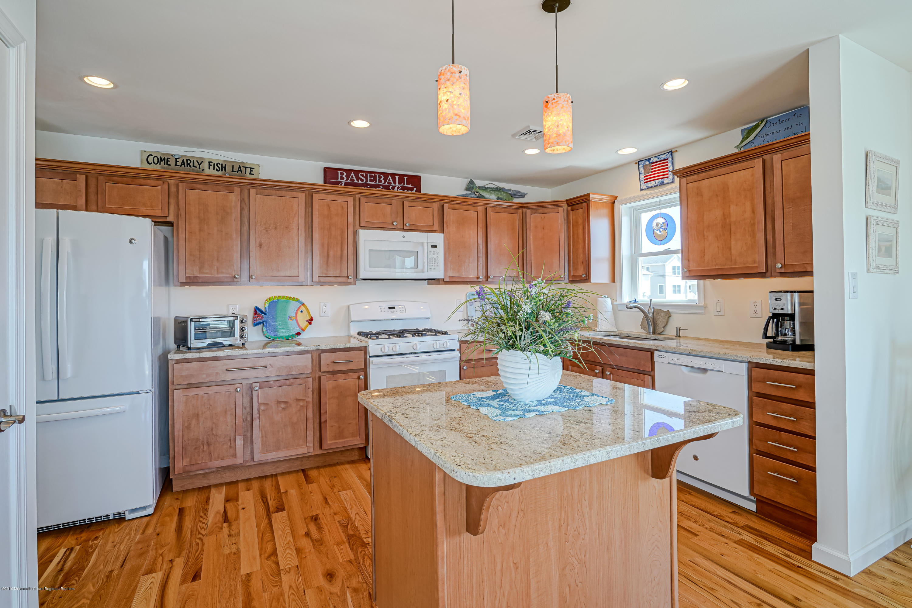 341 Kingfisher Road Tuckerton, NJ 08087 - Photo 12 of 38 a kitchen with granite countertop a refrigerator a stove a sink dishwasher and white cabinets with wooden floor