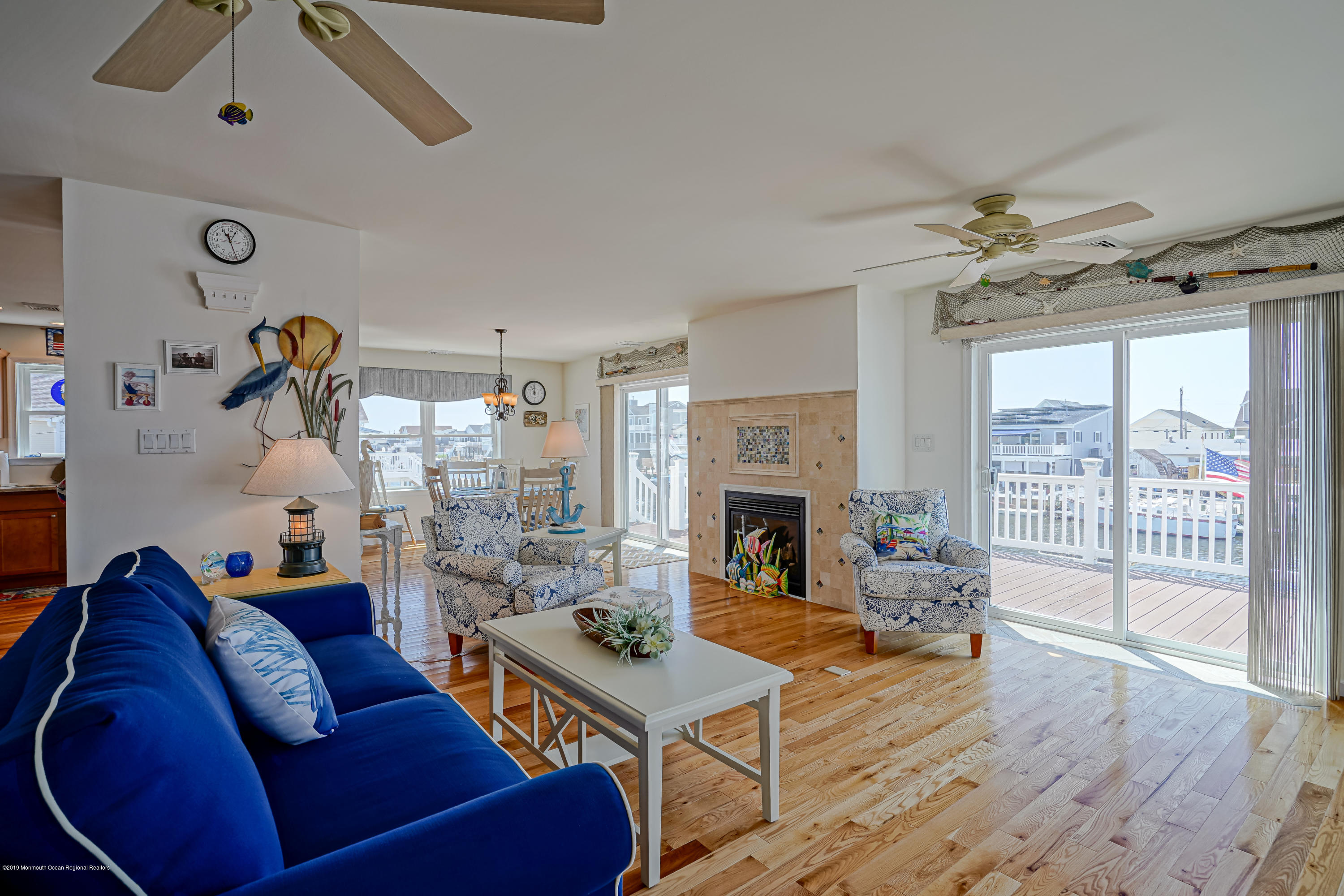 341 Kingfisher Road Tuckerton, NJ 08087 - Photo 3 of 38 a living room with furniture a flat screen tv and a fireplace