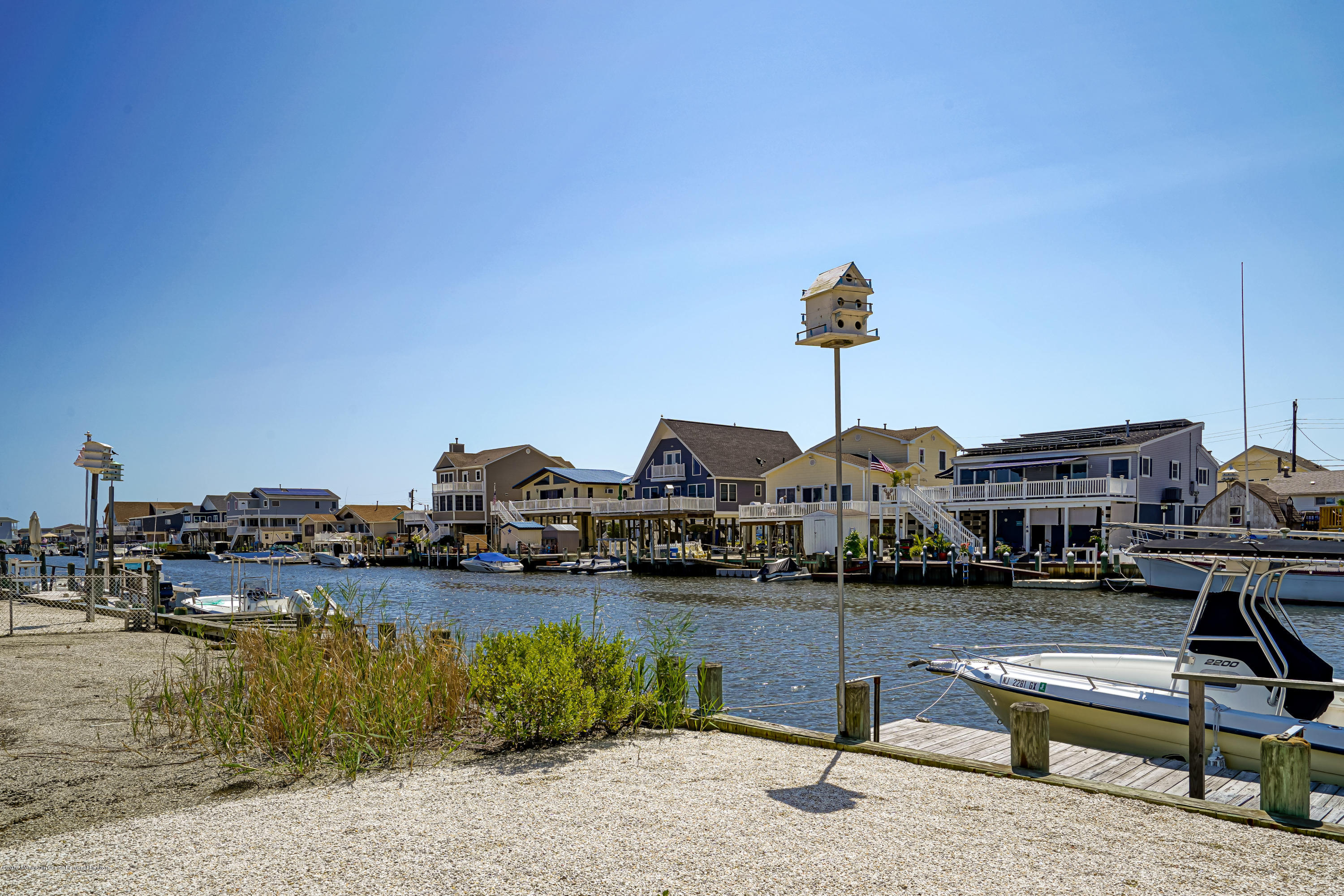 341 Kingfisher Road Tuckerton, NJ 08087 - Photo 35 of 38 a view of pool with lawn chairs and ocean view