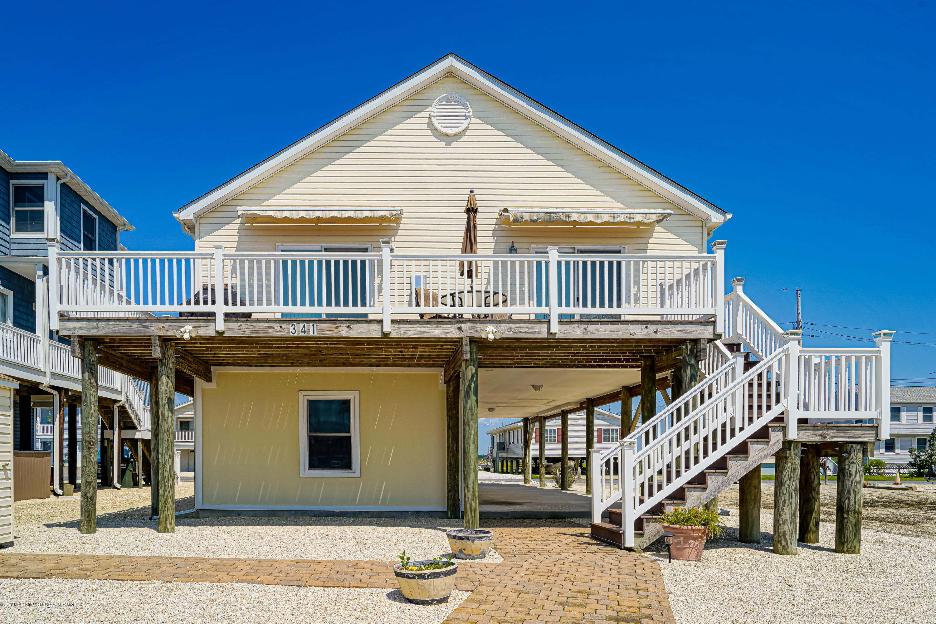 341 Kingfisher Road Tuckerton, NJ 08087 - Photo 38 of 38 a view of residential houses with deck and kitchen
