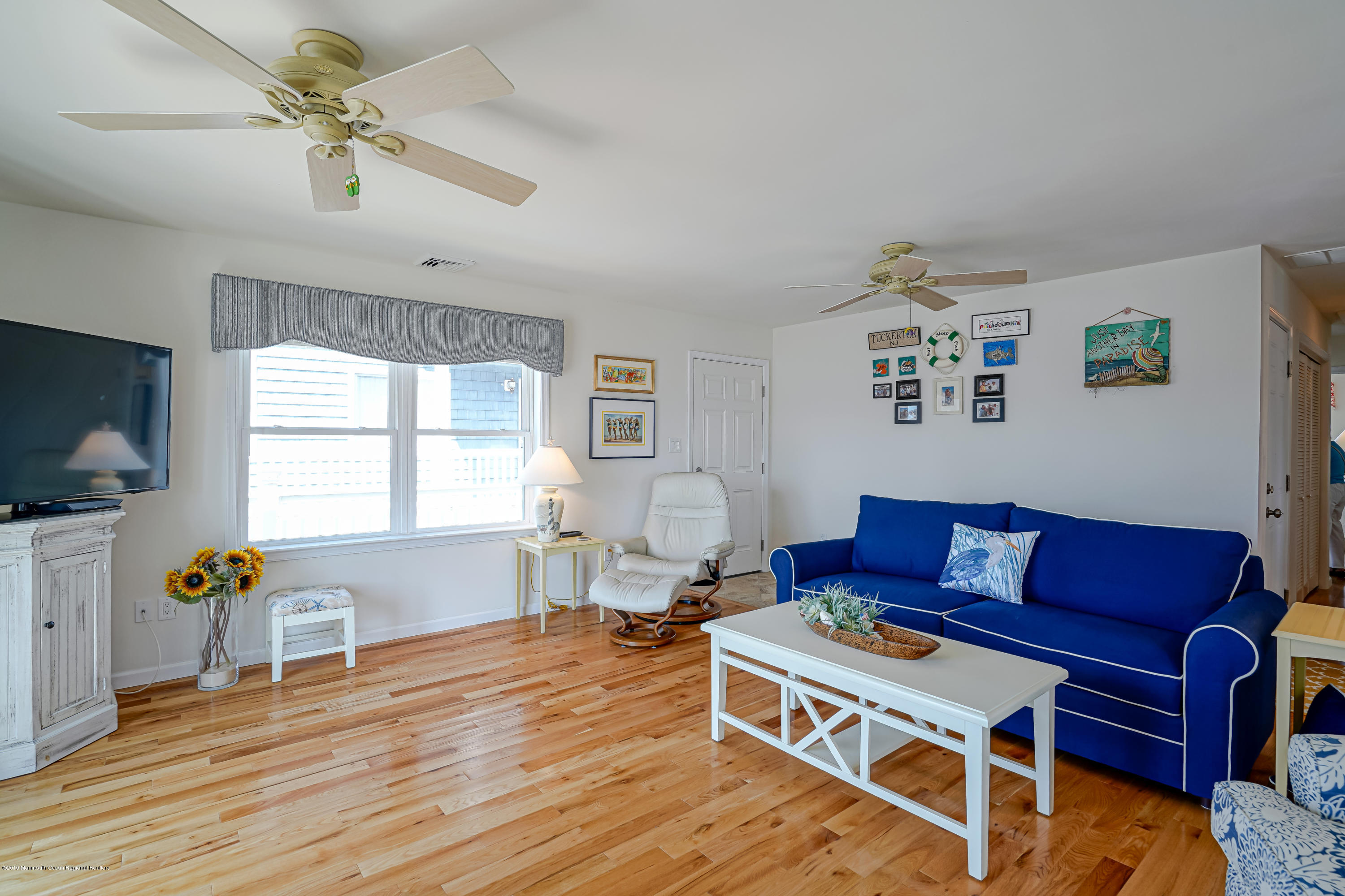 341 Kingfisher Road Tuckerton, NJ 08087 - Photo 7 of 38 a living room with furniture a flat screen tv and a window