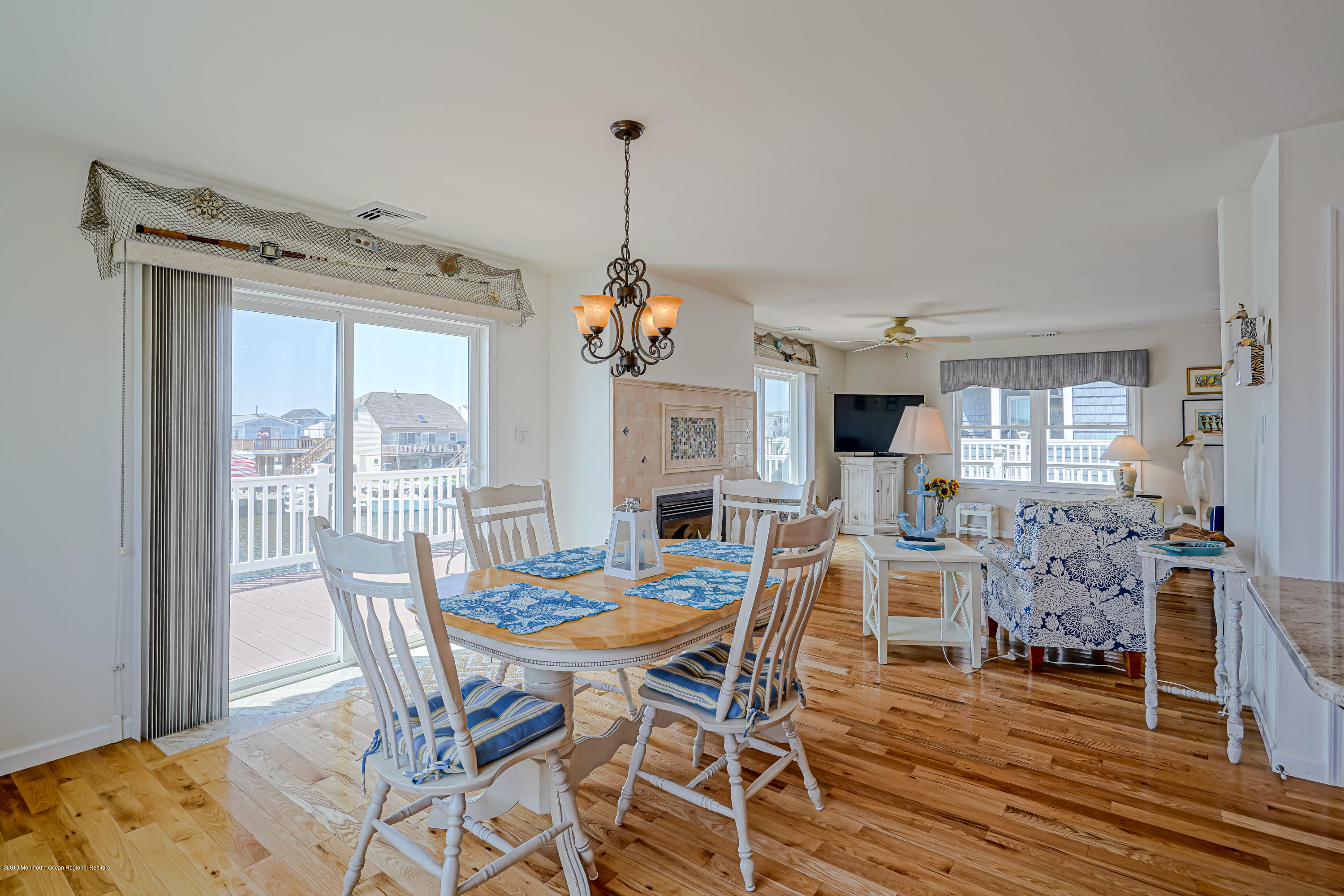 341 Kingfisher Road Tuckerton, NJ 08087 - Photo 10 of 38 a view of a dining room with furniture window and wooden floor