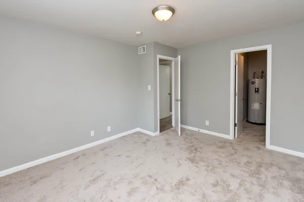 an empty room with closet area
