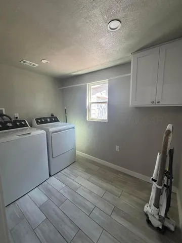 a storage room with washer and dryer