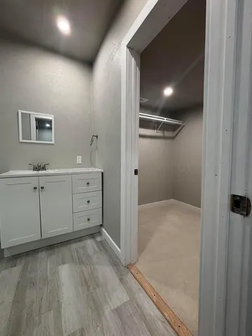 a view of a hallway with closet