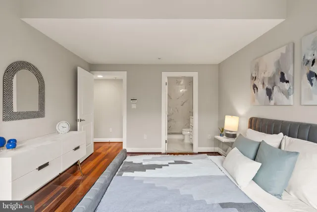 a spacious bedroom with a bed and a couch