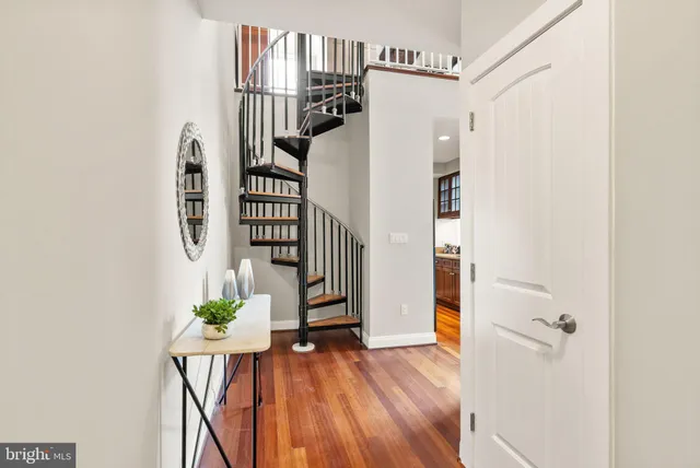 a view of entryway with wooden floor