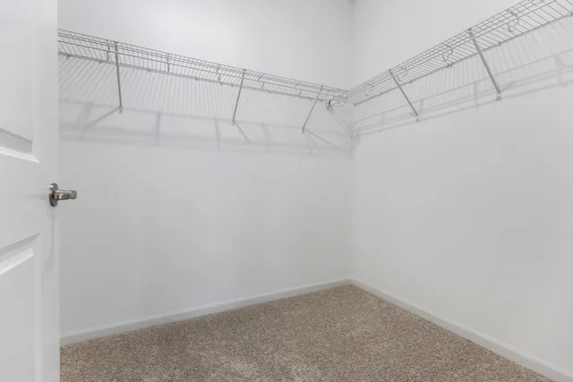 a bathroom with a toilet a sink a mirror a bathtub and vanity