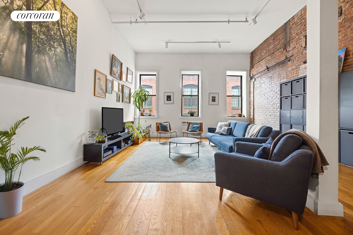 a living room with furniture fireplace and flat screen tv