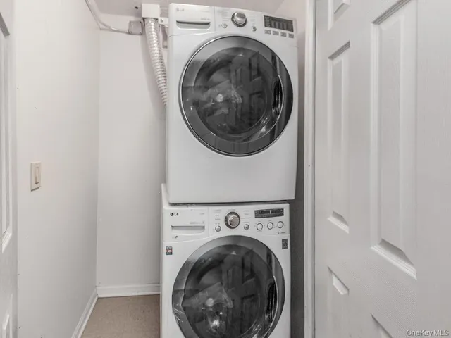 a view of a hallway with washer and dryer