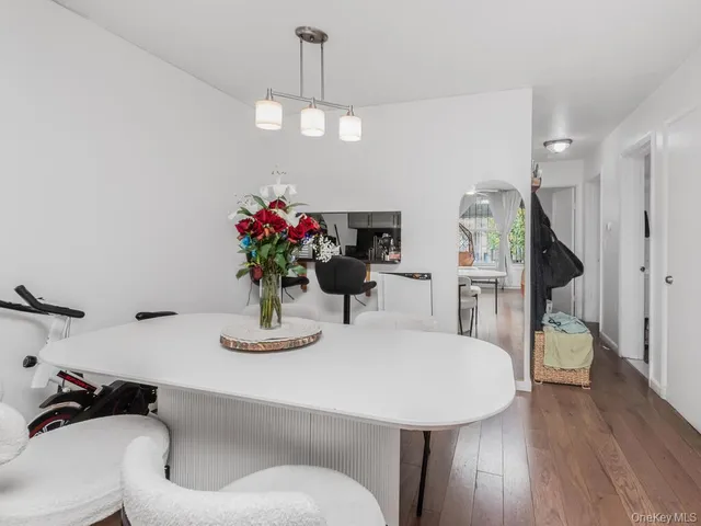 a dining room with furniture and wooden floor