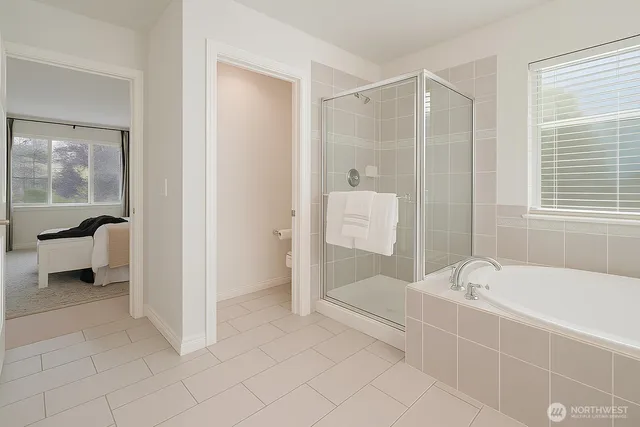 a white bath tub sitting next to a white sink