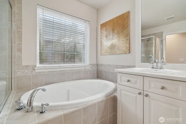 a living room with furniture a couch and a wall painting