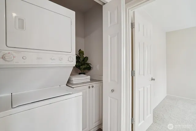 a bathroom with double vanity sinks a mirror and a shower