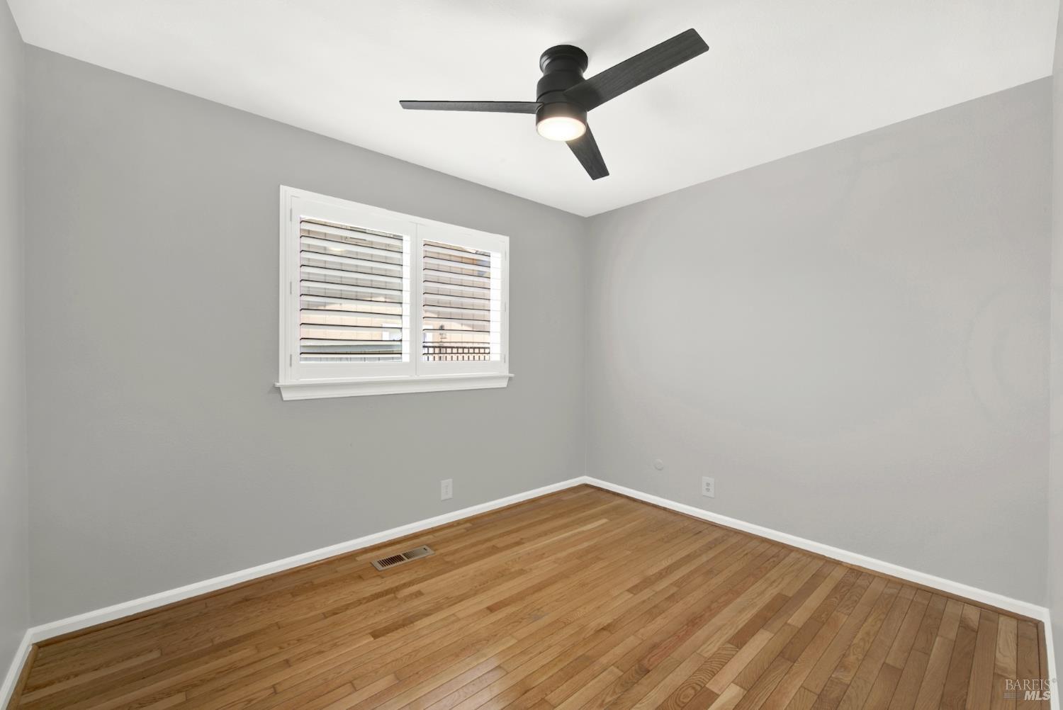 1270 Willow Lake Road Discovery Bay, CA 94505 - Photo 18 of 29 a view of empty room with wooden floor and fan