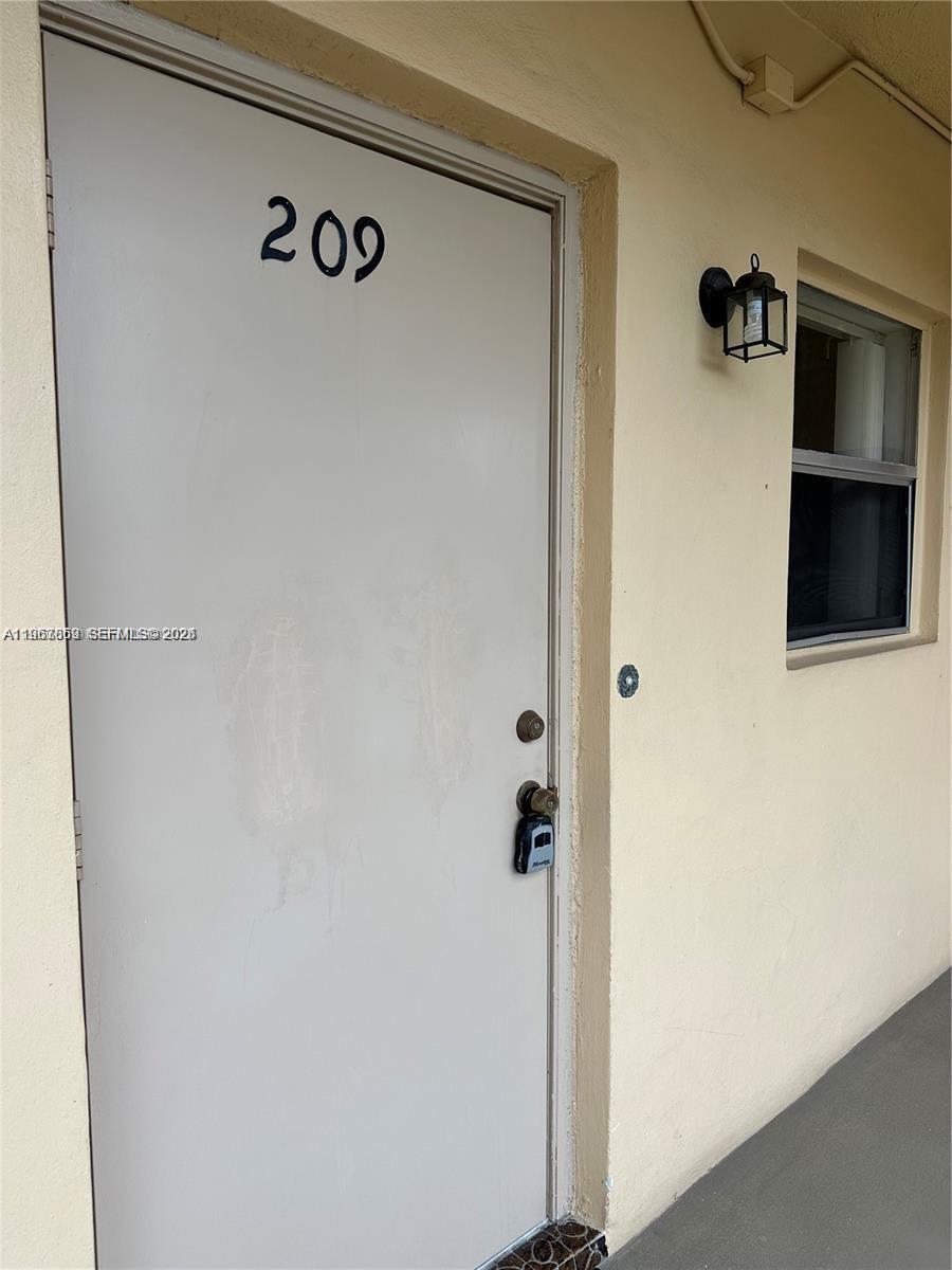 200 Ashbury Road, Unit 209 Hollywood, FL 33024 - Photo 3 of 18 a view of door