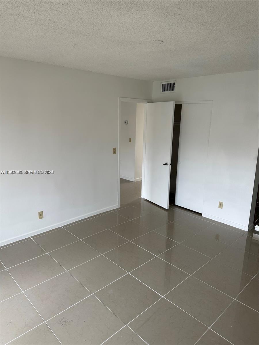 200 Ashbury Road, Unit 209 Hollywood, FL 33024 - Photo 9 of 18 a view of an empty room