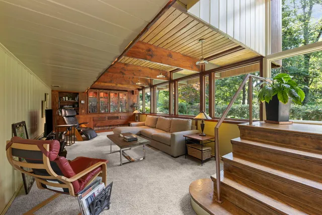 a outdoor space with patio the couches and pool table with chairs and potted plants
