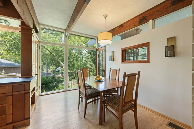 a view of a dining room with furniture window and outside view