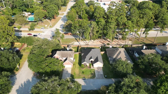 an aerial view of residential houses with outdoor space