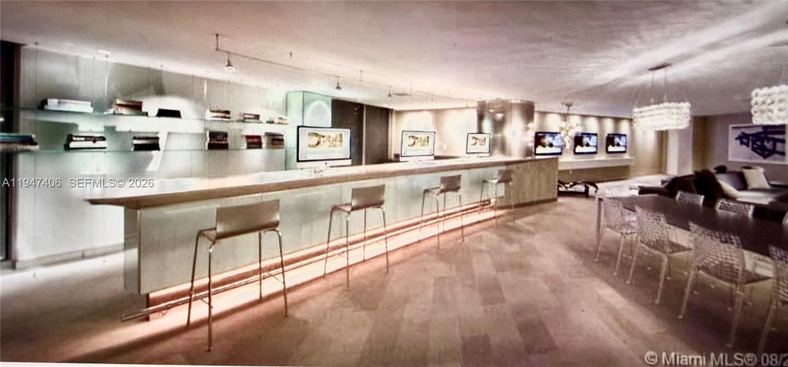 92 Southwest 3rd Street, Unit 4309 Miami, FL 33130 - Photo 15 of 16 a large white kitchen with lots of counter space and window