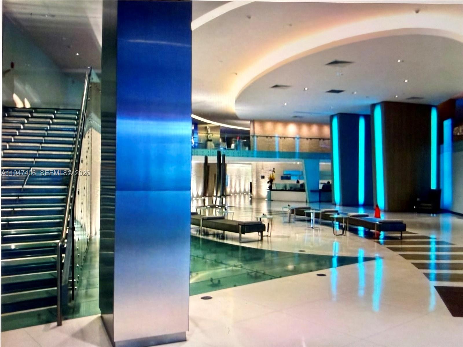 92 Southwest 3rd Street, Unit 4309 Miami, FL 33130 - Photo 2 of 16 a view of swimming pool with lawn chairs and a yard