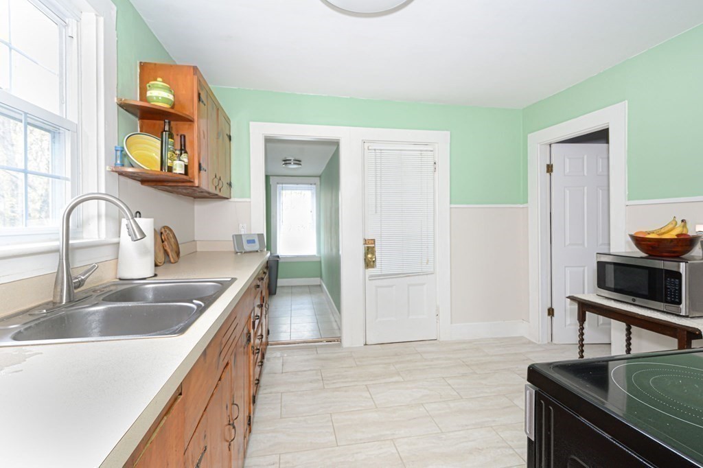 8 Myrtle Street Westborough, MA 01581 - Photo 14 of 35 a kitchen that has a sink and a stove