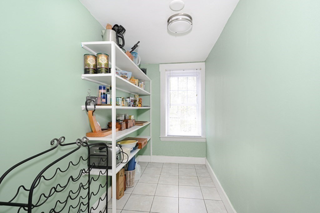 8 Myrtle Street Westborough, MA 01581 - Photo 15 of 35 an empty room with a bookshelf and a window