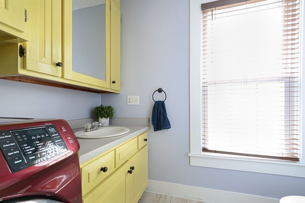 8 Myrtle Street Westborough, MA 01581 - Photo 17 of 35 a kitchen with a stove a sink and a window