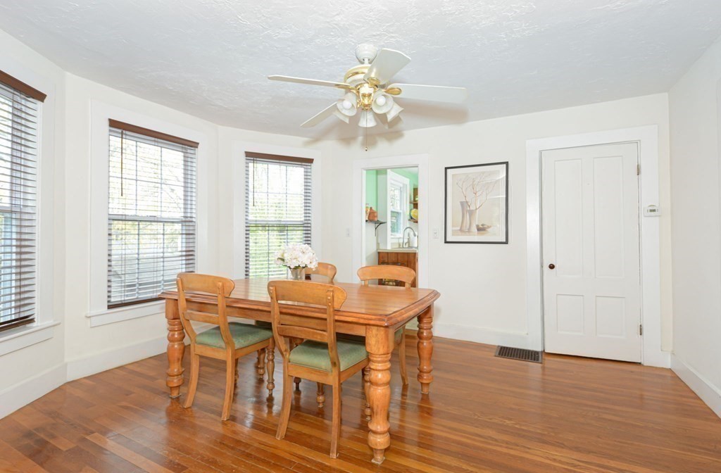 8 Myrtle Street Westborough, MA 01581 - Photo 22 of 35 a view of a dining room with furniture wooden floor and chandelier