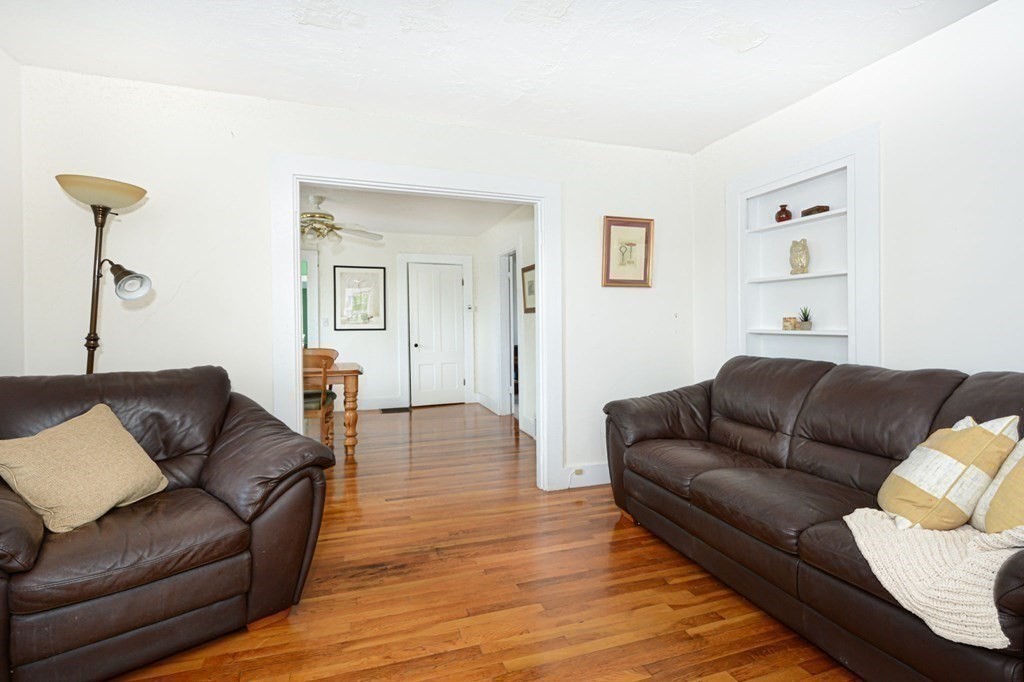 8 Myrtle Street Westborough, MA 01581 - Photo 24 of 35 a living room with furniture and a wooden floor