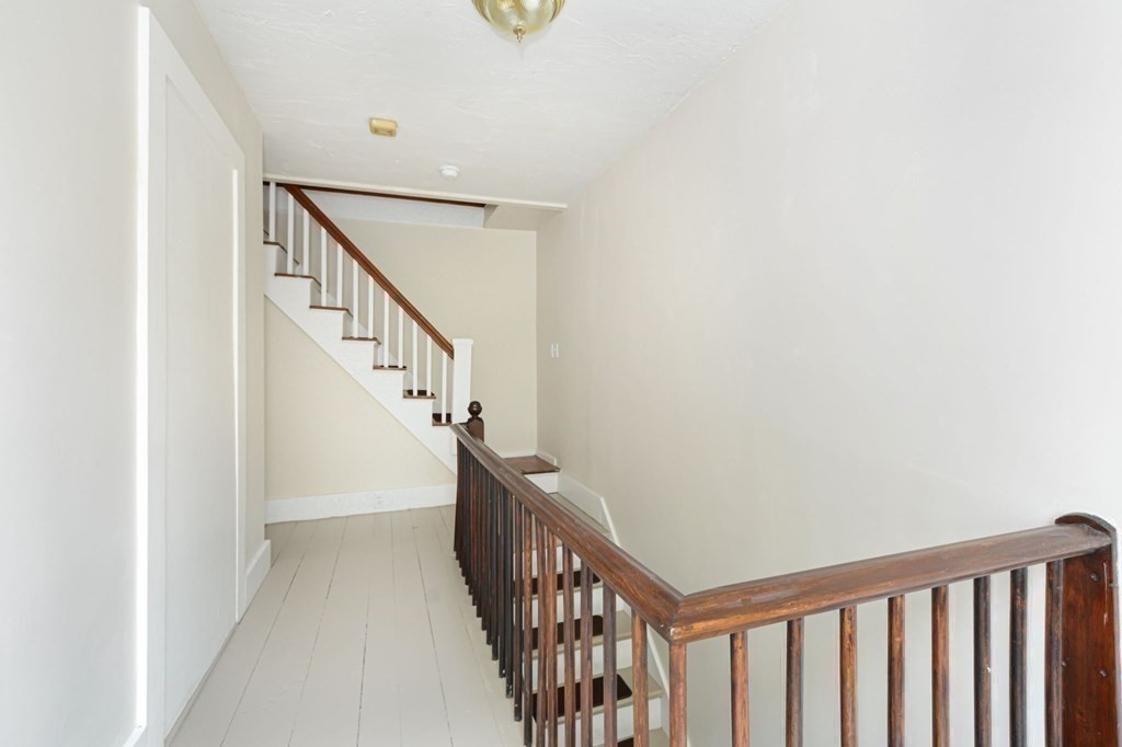 8 Myrtle Street Westborough, MA 01581 - Photo 27 of 35 a view of staircase with railing and white walls