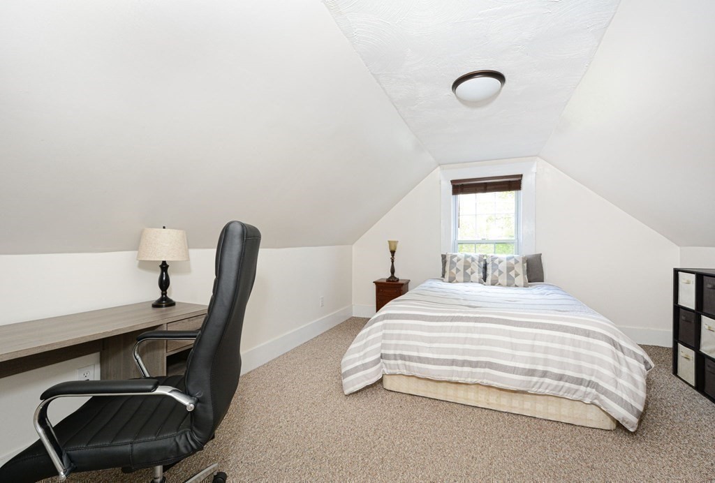 8 Myrtle Street Westborough, MA 01581 - Photo 29 of 35 a bedroom with a bed and a desk