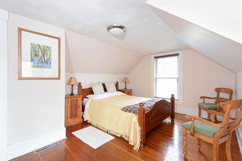 8 Myrtle Street Westborough, MA 01581 - Photo 30 of 35 a bedroom with a bed and wooden floor