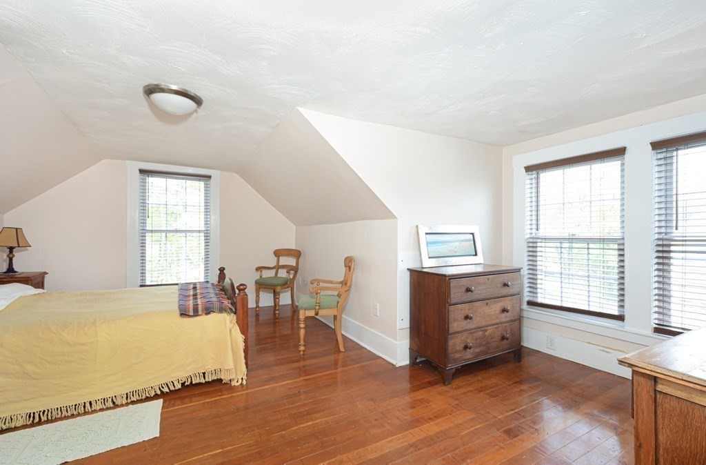 8 Myrtle Street Westborough, MA 01581 - Photo 31 of 35 a spacious bedroom with a bed and a dresser next to a window
