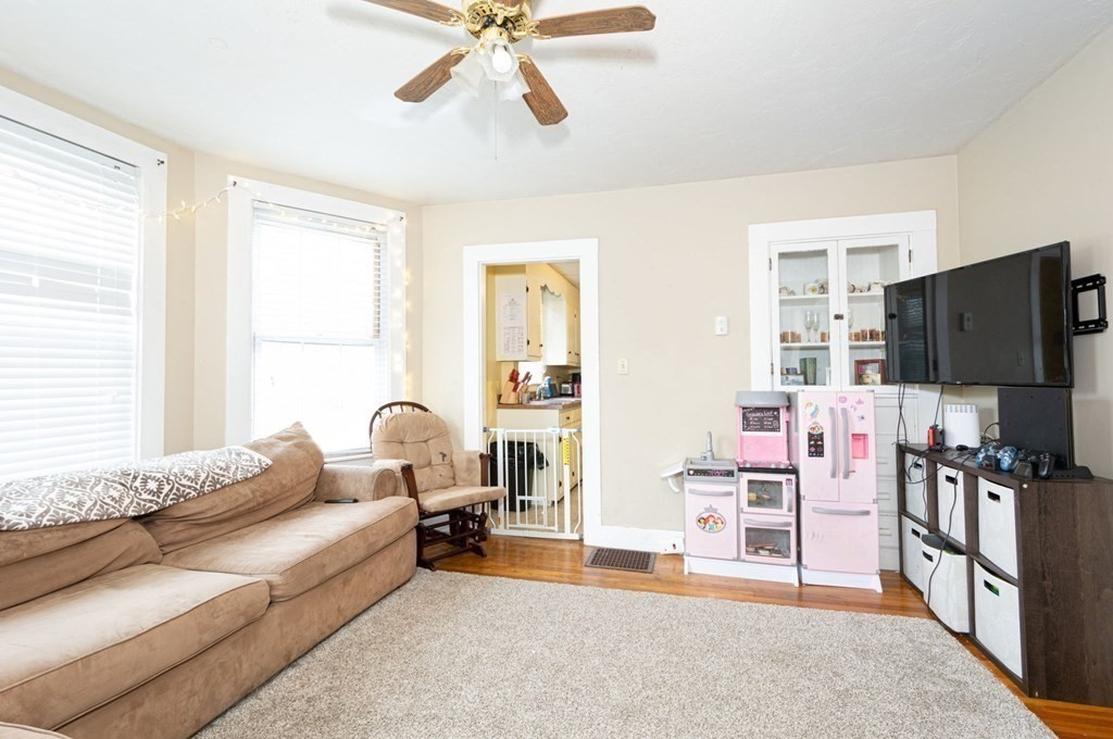 8 Myrtle Street Westborough, MA 01581 - Photo 5 of 35 a living room with furniture and a flat screen tv