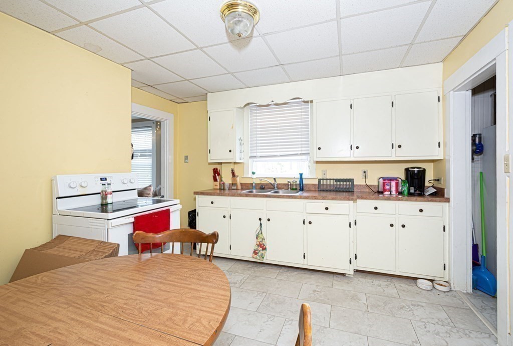 8 Myrtle Street Westborough, MA 01581 - Photo 7 of 35 a bed room with a bed and a cabinets