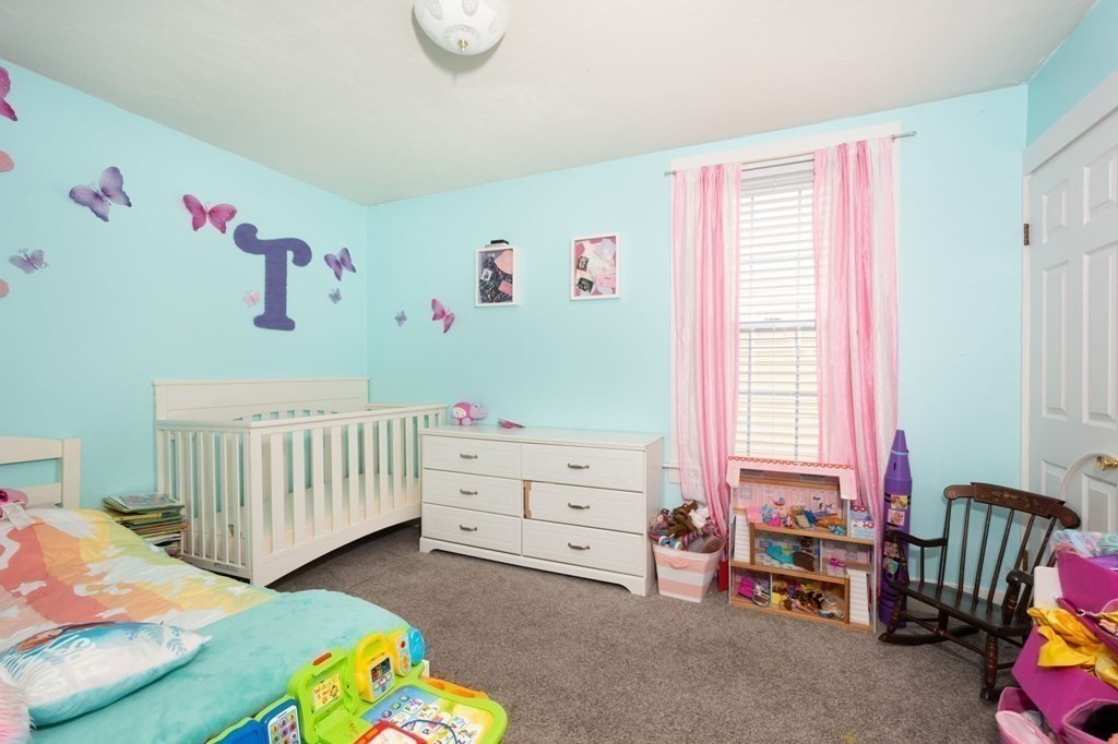 8 Myrtle Street Westborough, MA 01581 - Photo 9 of 35 a bedroom with a bed and a window