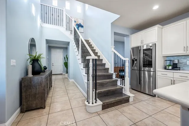 a bathroom with a granite countertop sink a mirror and a shower