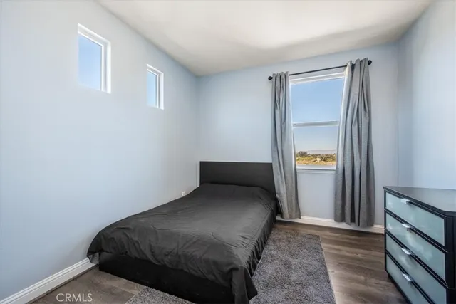 a bedroom with a bed and a mirror