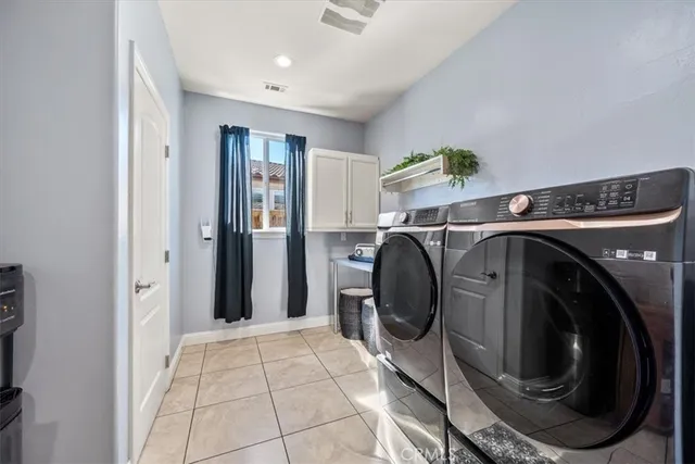 a bedroom with a bed and cabinets