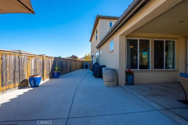 a view of a chairs and table in the patio