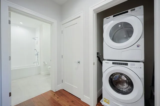 a view of a hallway with washer and dryer